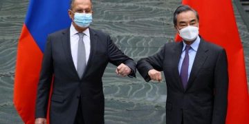 Rejecting criticism, Chinese and Russians meet in show of unity