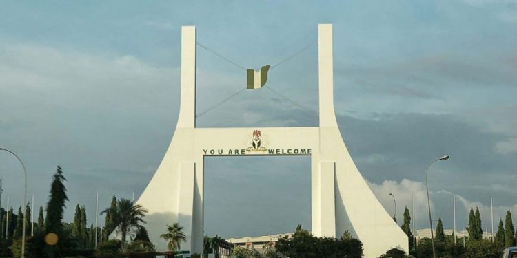 BREAKING: Pro-Buhari protesters fight while sharing money in Abuja