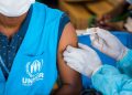 Excluding migrants undermines the success of COVID-19 vaccine rollouts