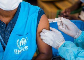 Excluding migrants undermines the success of COVID-19 vaccine rollouts