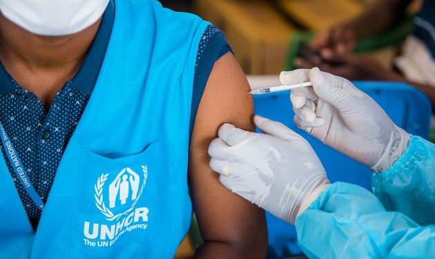 Excluding migrants undermines the success of COVID-19 vaccine rollouts