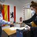 Exit polls show neck-and-neck race in Germany’s historic election