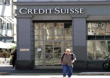 As investigation begins, Swiss police raid Credit Suisse offices