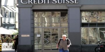 As investigation begins, Swiss police raid Credit Suisse offices