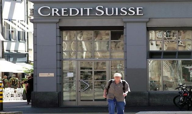 As investigation begins, Swiss police raid Credit Suisse offices