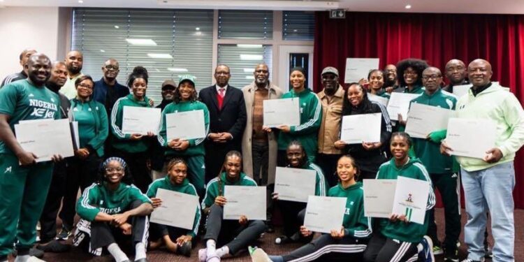 Tinubu hands over promised certificates of national honours, housing documents to D’Tigress players for 2025 AfroBasket win