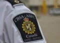 Canadian authorities charged two men for defrauding international students $126,000; hunt fleeing suspect