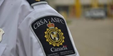 Canadian authorities charged two men for defrauding international students $126,000; hunt fleeing suspect