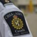 Canadian authorities charged two men for defrauding international students $126,000; hunt fleeing suspect