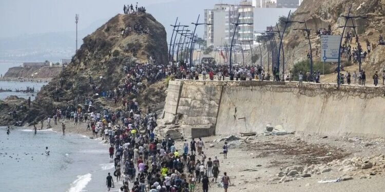 Morocco says 11 died during attempted crossing by 40,000 people to Spain’s Ceuta