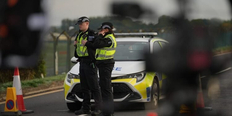 Masked men arrested in UK on suspected terror plot identified as British nationals in their 20s